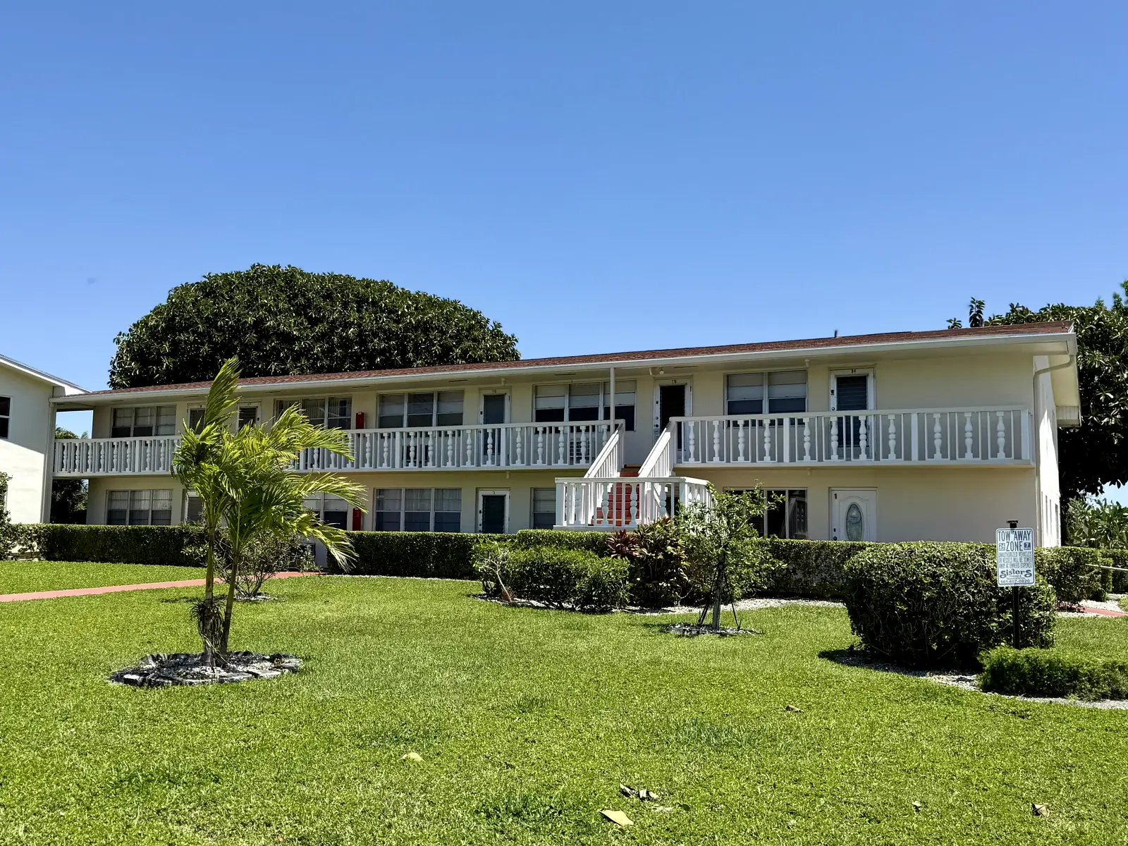 Well-kept Century Village building frontage and lawn
